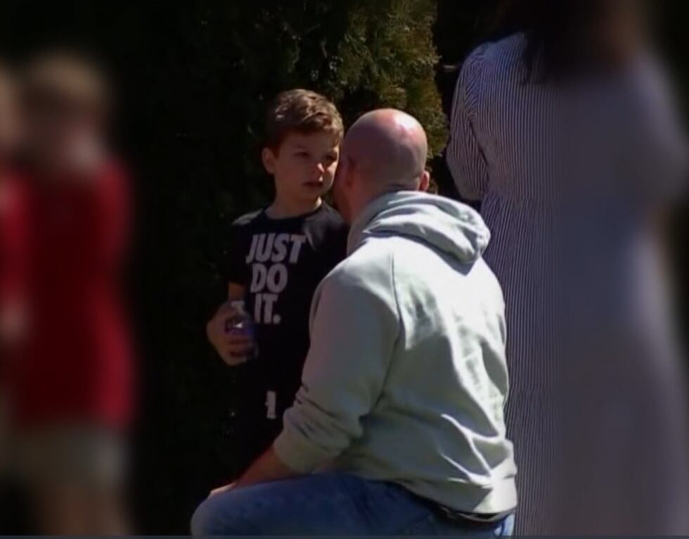 Nick Cavuoto comforts his son after Covenant School shooting on March 27th, 2023.