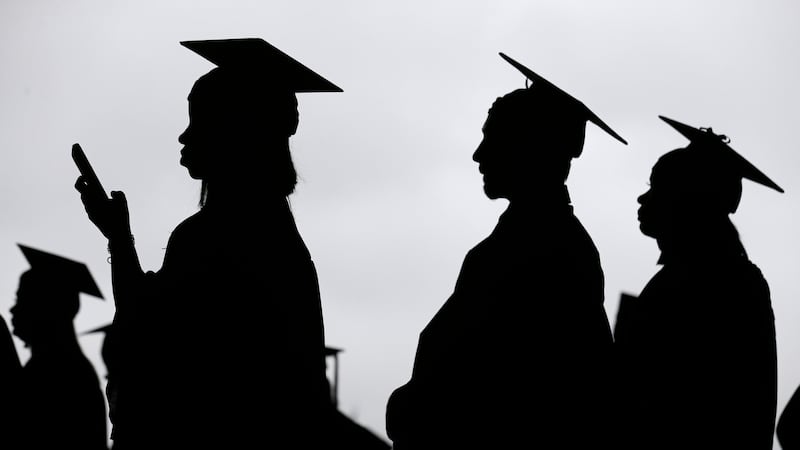FILE - New graduates line up before the start of the Bergen Community College commencement at...