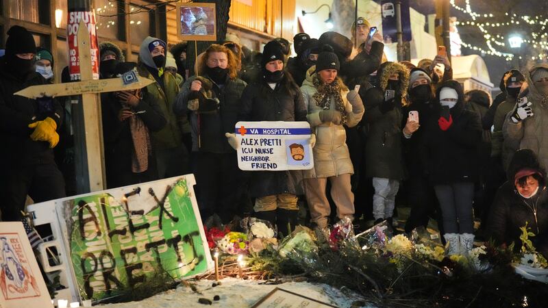 People gather during a vigil for 37-year-old Alex Pretti, who was fatally shot by a U.S....