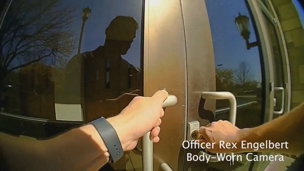 A still from officer body cam footage, shows an officer enter a school as a mass shooting is...