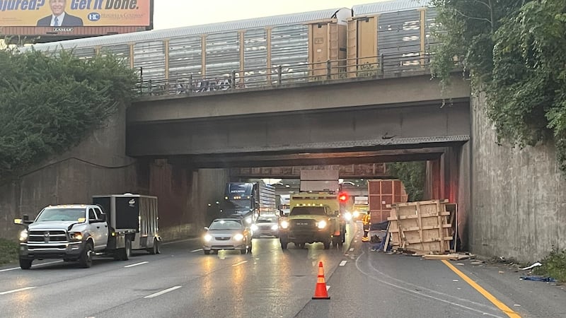 A truck carrying a large load struck a low bridge in Nashville on Thursday morning.