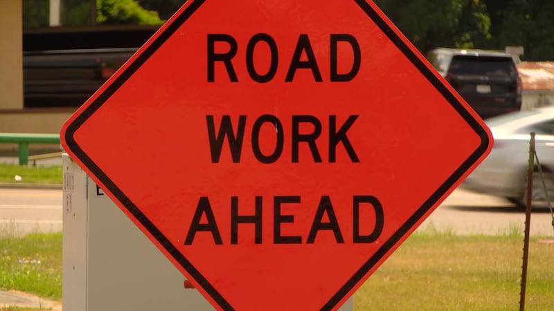 A construction worker was hit by a truck after the driver ignored a flagger, an official says.