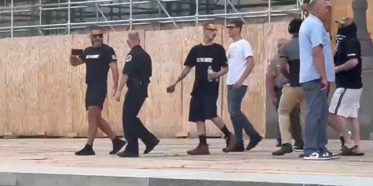 Neo-Nazi group seen leaving city hall after Metro Council chamber ...