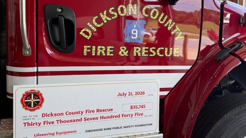 Dickson County Fire & Rescue received a check from Firehouse Subs for new extricators.