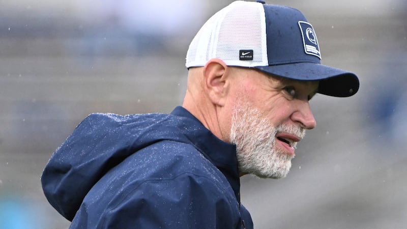 Penn State defensive coordinator Jim Knowles watches warm ups for an NCAA college football...
