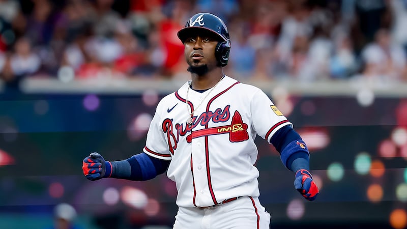 Atlanta Braves' Ozzie Albies (1) reacts after hitting double against the New York Mets during...