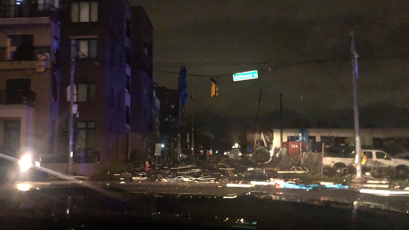 Debris scattered across an intersection Tuesday, March 3, 2020, in downtown Nashville, Tenn....