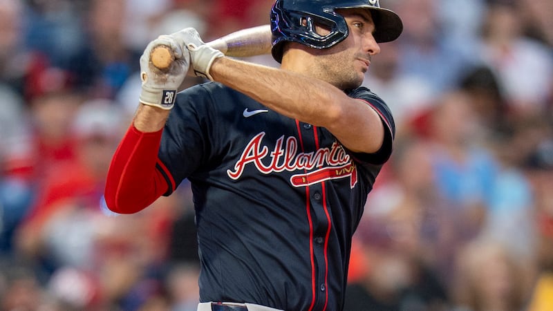 Atlanta Braves' Matt Olson hits a double scoring Jurickson Profar during the sixth inning of a...