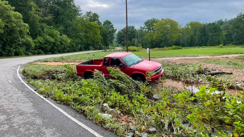 A man was rescued Tuesday night after flood waters swept his pickup truck off the road.